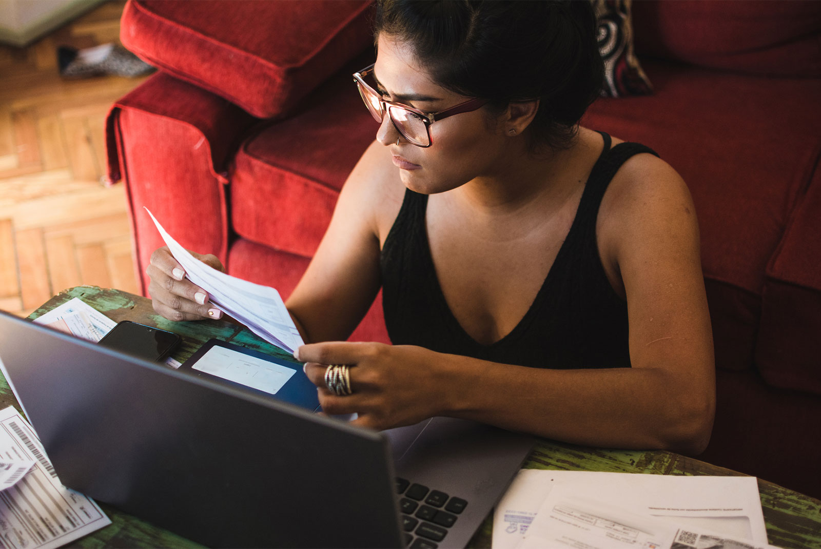 woman at home with bills wondering how to get a personal loan
